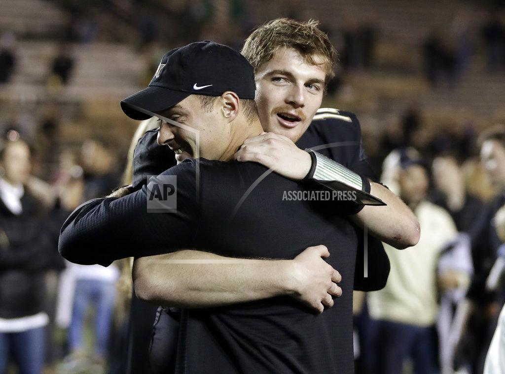 Mark Humphrey Vanderbilt quarterback Kyle Shurmur, right, gets a hug after the team defeated Tennessee in an NCAA college football game Saturday, Nov. 24, 2018, in Nashville, Tenn. (AP Photo/Mark Humphrey)
