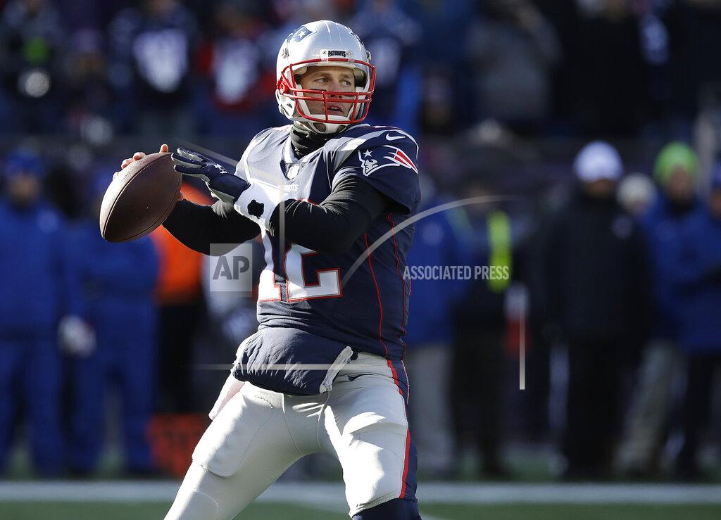 Charles Krupa New England Patriots quarterback Tom Brady drops back to pass against the Los Angeles Chargers defensive during the first half of an NFL divisional playoff football game, Sunday, Jan. 13, 2019, in Foxborough, Mass. (AP Photo/Charles Krupa)