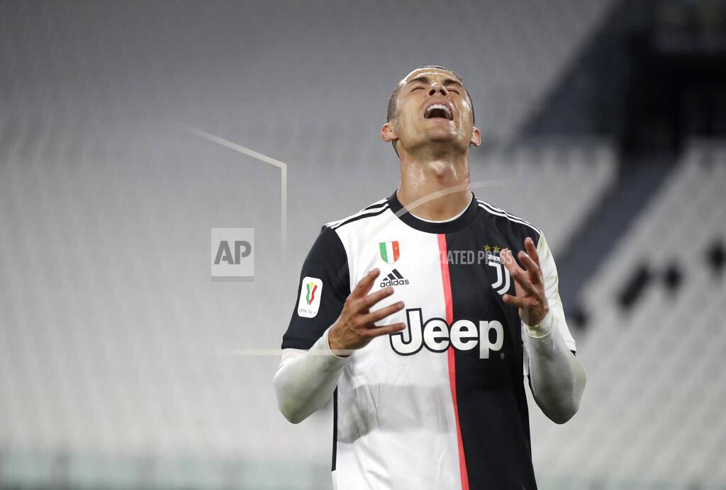 Luca Bruno Juventus' Cristiano Ronaldo reacts during an Italian Cup second leg soccer match between Juventus and AC Milan at the Allianz stadium, in Turin, Italy, Friday, June 12, 2020. The match was being played without spectators because of the coronavirus lockdown. (AP Photo/Luca Bruno)