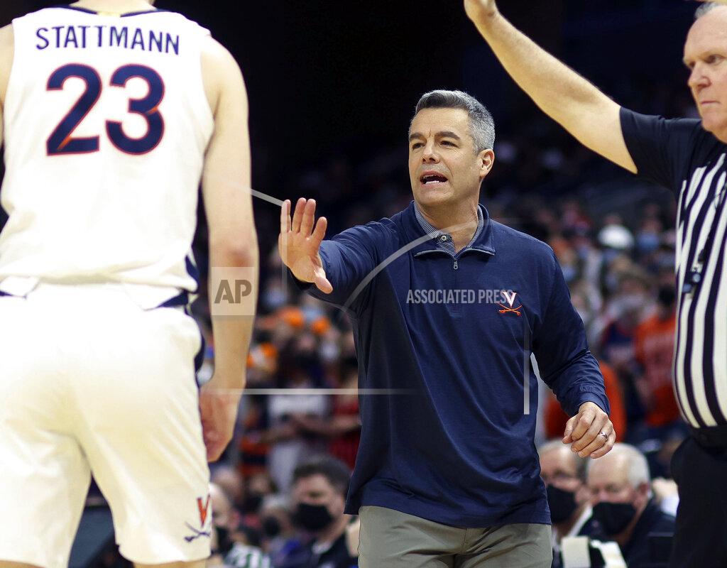 Andrew Shurtleff Virginia head coach Tony Bennett calls a play to Virginia guard Kody Stattmann (23) during an NCAA college basketball game against Miami in Charlottesville, Va., Saturday, Feb. 5, 2022. (AP Photo/Andrew Shurtleff)