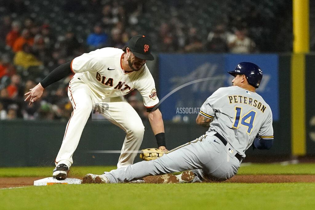 Jeff Chiu Milwaukee Brewers' Jace Peterson (14) is tagged out while trying to steal third by San Francisco Giants third baseman Kris Bryant during the fourth inning of a baseball game in San Francisco, Monday, Aug. 30, 2021. (AP Photo/Jeff Chiu)