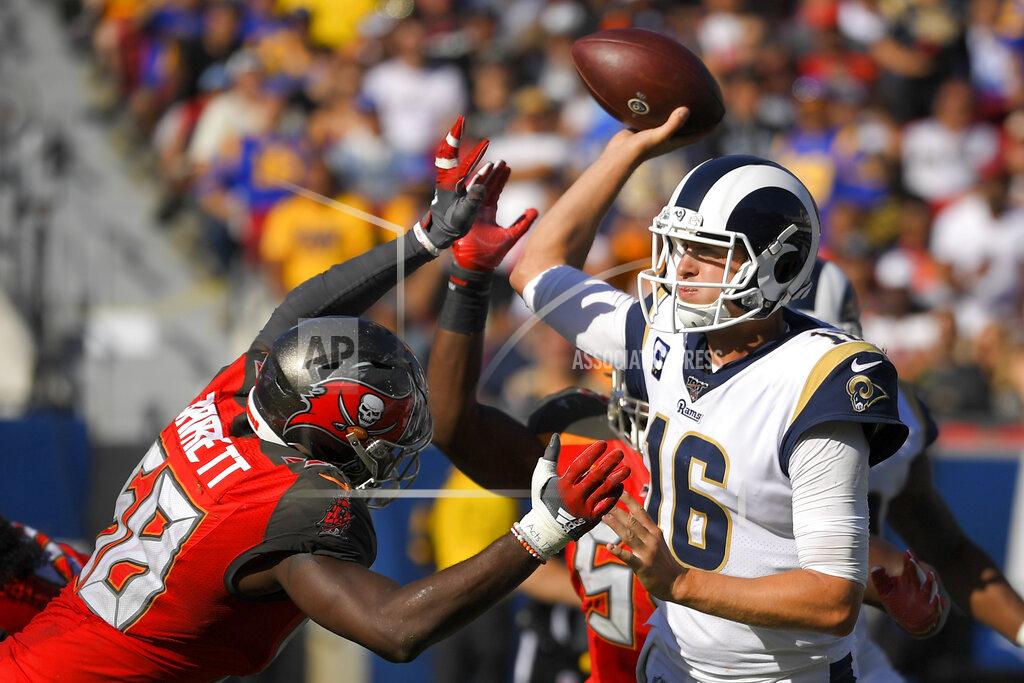 Los Angeles Rams quarterback Jared Goff, right, passes under pressure from Tampa Bay Buccaneers linebacker Shaquil Barrett during the second half of an NFL football game Sunday, Sept. 29, 2019, in Los Angeles. (AP Photo/Mark J. Terrill)
