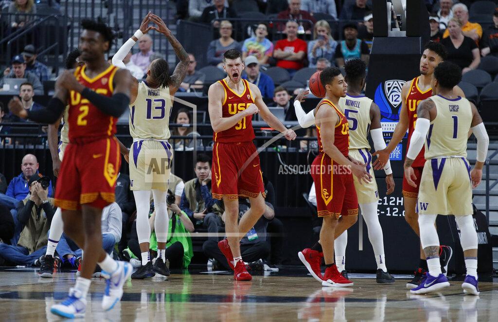 John Locher Southern California's Nick Rakocevic, center, reacts after a play against Washington during the first half of an NCAA college basketball game in the quarterfinal round of the Pac-12 men's tournament Thursday, March 14, 2019, in Las Vegas. (AP Photo/John Locher)