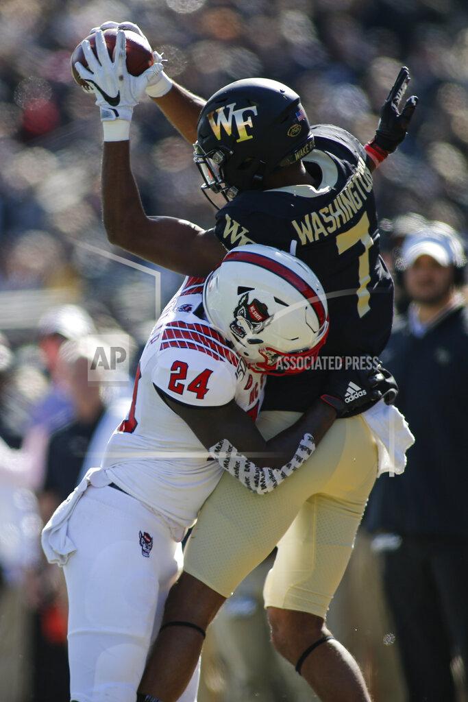 Nell Redmond Wake Forest wide receiver Scotty Washington, right, catches a pass out of bounds against North Carolina State cornerback Malik Dunlap in the first half of an NCAA college football game in Winston-Salem, N.C., Saturday, Nov. 2, 2019. Wake Forest won 44-10. (AP Photo/Nell Redmond)