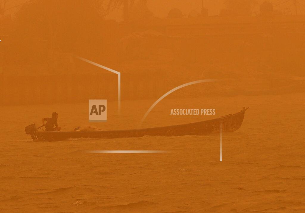 Nabil Al-Jurani A fisherman navigates his boat on the Shatt al-Arab waterway during a sandstorm in Basra, Iraq, Monday, May 23, 2022. (AP Photo/Nabil al-Jurani)