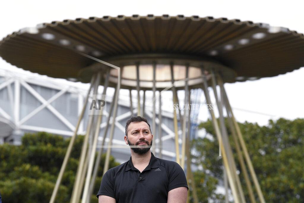 Dean Lewins Australian Olympian Ian Thorpe stands in front of the Sydney 2000 Olympic Cauldron as it's lit to celebrate the 20th anniversary of the Sydney 2000 Olympic Games in Sydney, Tuesday, Sept. 15, 2020. With three swim gold medals and two silver, several in world-record time, Thorpe, then only 17, was the most successful Australian performer in Sydney. (Dean Lewins/AAP Image via AP)