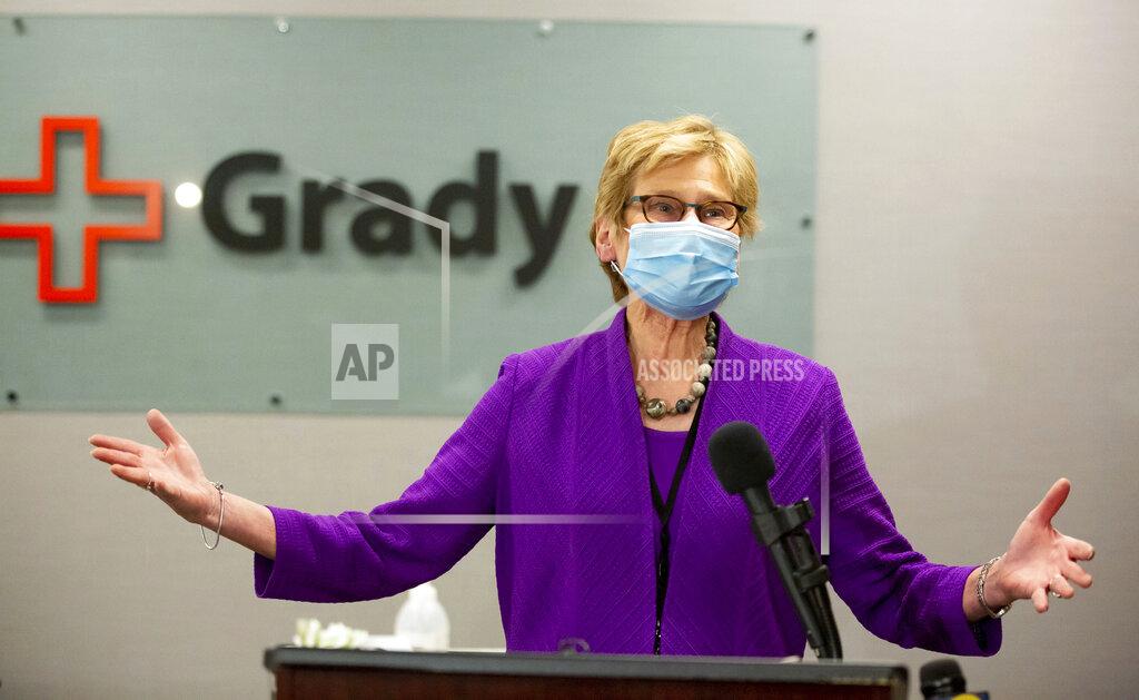 Steve Schaefer Dr. Kathleen Toomey provides updates on COVID-19 in Georgia at a press conference before receiving her COVID-19 vaccination at Grady Hospital on December 17, 2020. (Steve Schaefer/Atlanta Journal-Constitution via AP)
