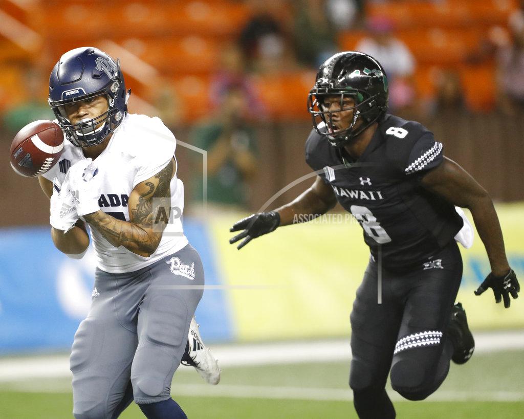 Marco Garcia While being guarded by Hawaii defensive back Eugene Ford (8), Nevada wide receiver Brendan O'Leary-Orange (17) can't hold on to a pass during the third quarter of an NCAA college football game Saturday, Oct. 20, 2018, in Honolulu. (AP Photo/Marco Garcia)