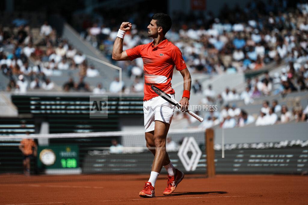 Thibault Camus Serbia's Novak Djokovic reacts after winning a point as he plays Slovenia's Aljaz Bedene during their third round match of the French Open tennis tournament at the Roland Garros stadium Friday, May 27, 2022 in Paris. (AP Photo/Thibault Camus)