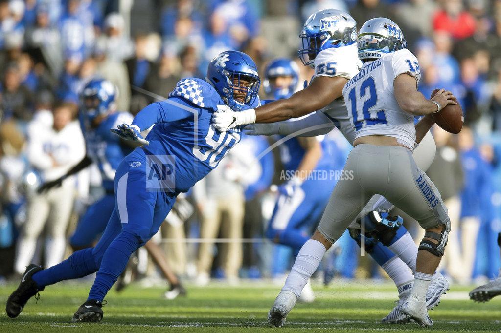 Bryan Woolston Kentucky defensive end T.J. Carter (90) pressures Middle Tennessee quarterback Brent Stockstill (12) during the second half of an NCAA college football game in Lexington, Ky., Saturday, Nov. 17, 2018. (AP Photo/Bryan Woolston)