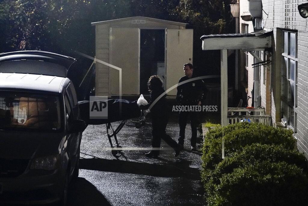 Brynn Anderson A body is taken away from Gold Spa massage parlor after a shooting, late Tuesday, March 16, 2021, in Atlanta. Shootings at two massage parlors in Atlanta and one in the suburbs left multiple people dead, many of them women of Asian descent, authorities said. A 21-year-old man suspected in the shootings was taken into custody in southwest Georgia hours later after a manhunt, police said. (AP Photo/Brynn Anderson)