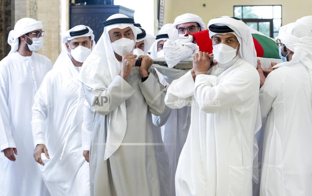 Hamad Al Kaabi This photo made available by the Ministry of Presidential Affairs, shows Sheikh Mohamed bin Zayed Al Nahyan, ruler of Abu Dhabi, front left, and Sheikh Mansour bin Zayed Al Nahyan, UAE Deputy Prime Minister and Minister of Presidential Affairs, front right, carry the body of Sheikh Khalifa bin Zayed Al Nahyan, president of the United Arab Emirates, with other members of royal family at Sheikh Sultan bin Zayed The First mosque, in Abu Dhabi, Friday, May 13, 2022. (Hamad Al Kaabi/Ministry of Presidential Affairs via AP)