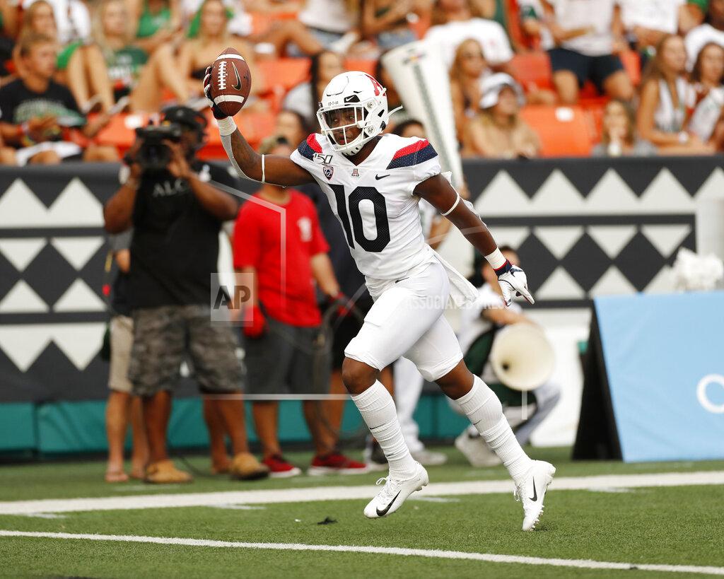 Marco Garcia Arizona wide receiver Jamarye Joiner (10) runs in for a touchdown against Hawaii during the second quarter of an NCAA college football game Saturday, Aug. 24, 2019, in Honolulu. (AP Photo/Marco Garcia)