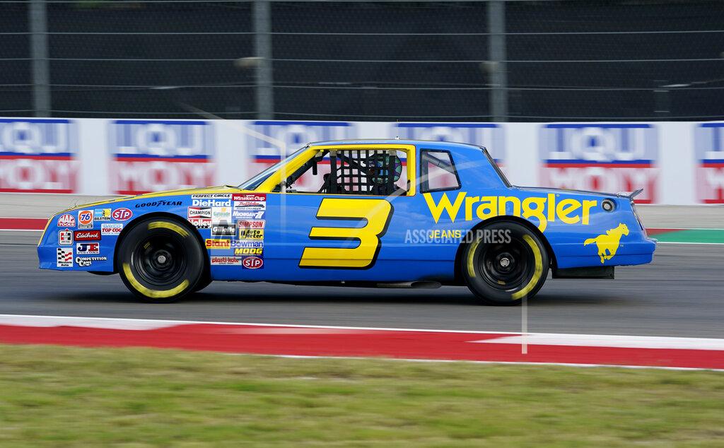 Eric Gay McLaren driver Daniel Ricciardo, of Australia, drives the late NASCAR driver Dale Earnhardt's iconic 1984 No. 3 Wrangler Chevrolet Monte Carlo before an open practice for the Formula One U.S. Grand Prix auto race at the Circuit of the Americas, Saturday, Oct. 23, 2021, in Austin, Texas. Ricciardo was allowed to drive the car as a reward from his McLaren boss, Zak Brown, for winning his first race with the team. (AP Photo/Eric Gay)