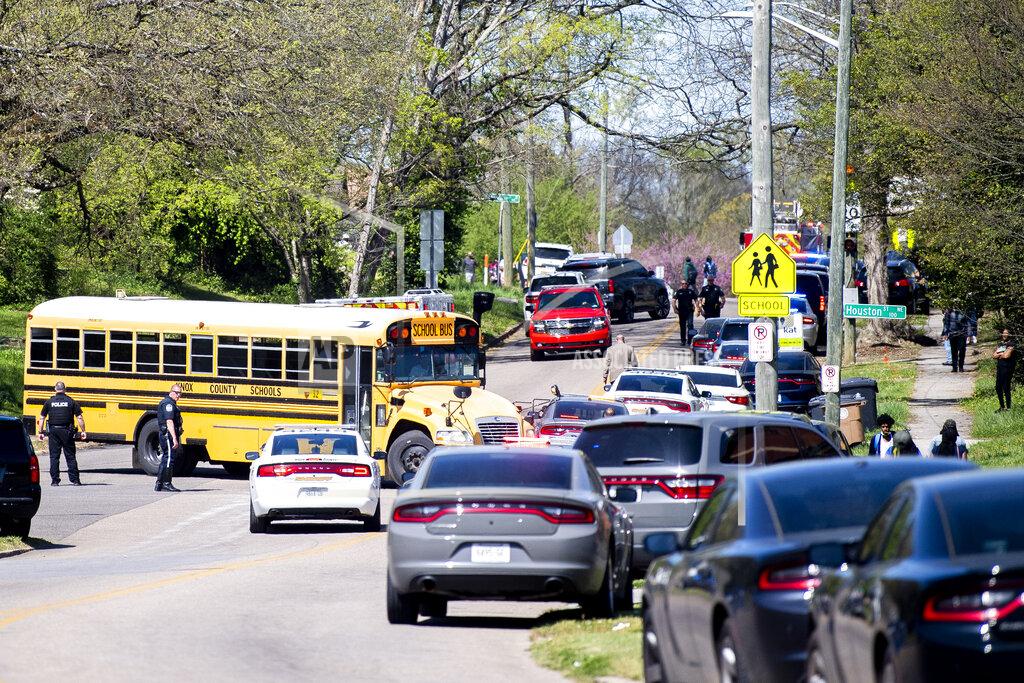 Brianna Paciorka Police work in the area of Austin-East Magnet High School after a reported shooting Monday, April 12, 2021. Authorities say multiple people including a police officer have been shot at the school. (Brianna Paciorka/Knoxville News Sentinel via AP)