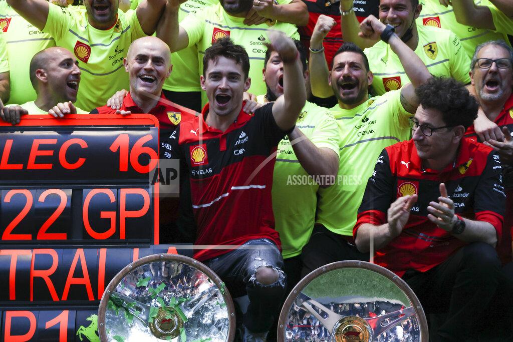 Asanka Brendon Ratnayake Ferrari driver Charles Leclerc, centre, of Monaco celebrates with his team after winning the Australian Formula One Grand Prix in Melbourne, Australia, Sunday, April 10, 2022. (AP Photo/Asanka Brendon Ratnayake)
