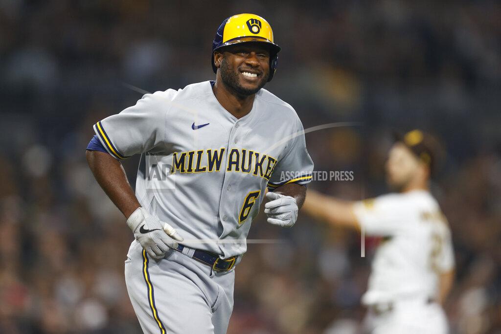 Mike Mcginnis Milwaukee Brewers' Lorenzo Cain smiles while running to first base after drawing a walk against the San Diego Padres during the fourth inning of a baseball game Monday, May 23, 2022, in San Diego. (AP Photo/Mike McGinnis)