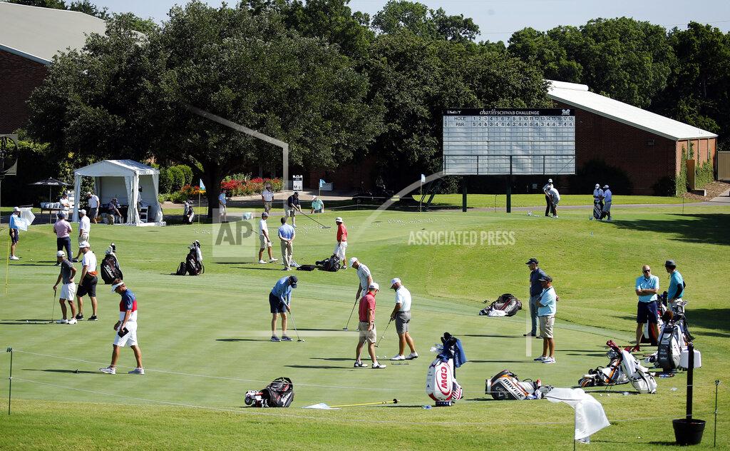 Tom Fox Golfers work on their putting and chipping around the practice greens during practice for the Charles Schwab Challenge golf tournament at the Colonial Country Club in Fort Worth, Texas, Tuesday, June 9, 2020. The Challenge is the first PGA tour event since the COVID-19 pandemic began. (Tom Fox/The Dallas Morning News via AP)