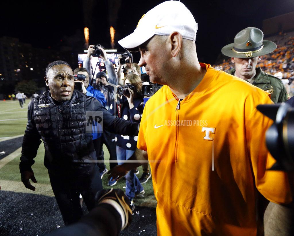 Mark Humphrey Vanderbilt head coach Derek Mason, left, meets Tennessee head coach Jeremy Pruitt on the field after an NCAA college football game Saturday, Nov. 24, 2018, in Nashville, Tenn. (AP Photo/Mark Humphrey)