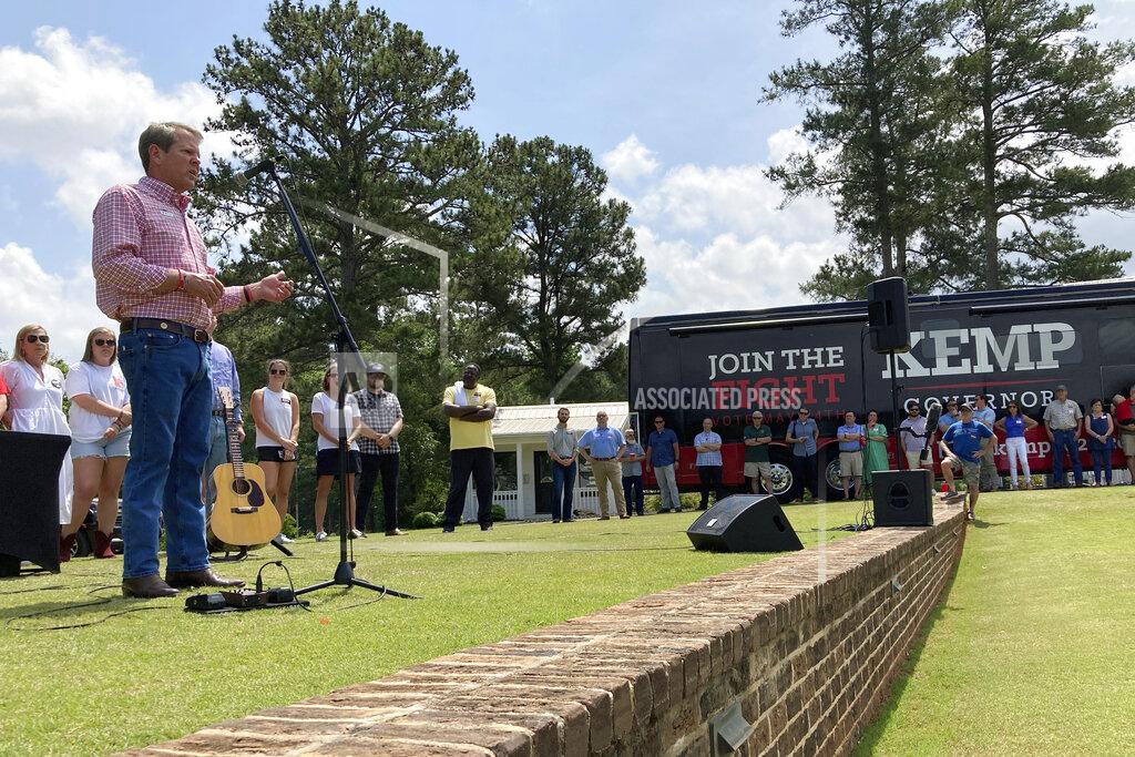Jeff Amy Georgia Gov. Brian Kemp addresses a get-out-the-vote rally on Saturday, May 21, 2022, in Watkinsville, Ga. The Republican Kemp is seeking to beat former U.S. Sen David Perdue and others in a Republican primary for governor on Tuesday, May 24, 2022 (AP Photo/Jeff Amy)