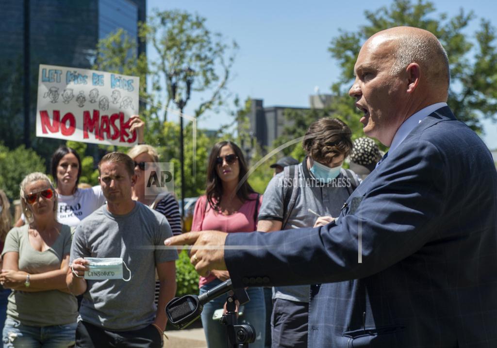 Rick Egan Commissioner Bill Lee speaks during a rally protesting against face masks being required in schools, before the Utah County Commission meeting in Provo, Utah, on Wednesday, July 15, 2020. County commissioners in Utah postponed the meeting Wednesday where they were expected to discuss mask mandates after people packed the room and ignored social distancing guidelines. (Rick Egan/The Salt Lake Tribune via AP)
