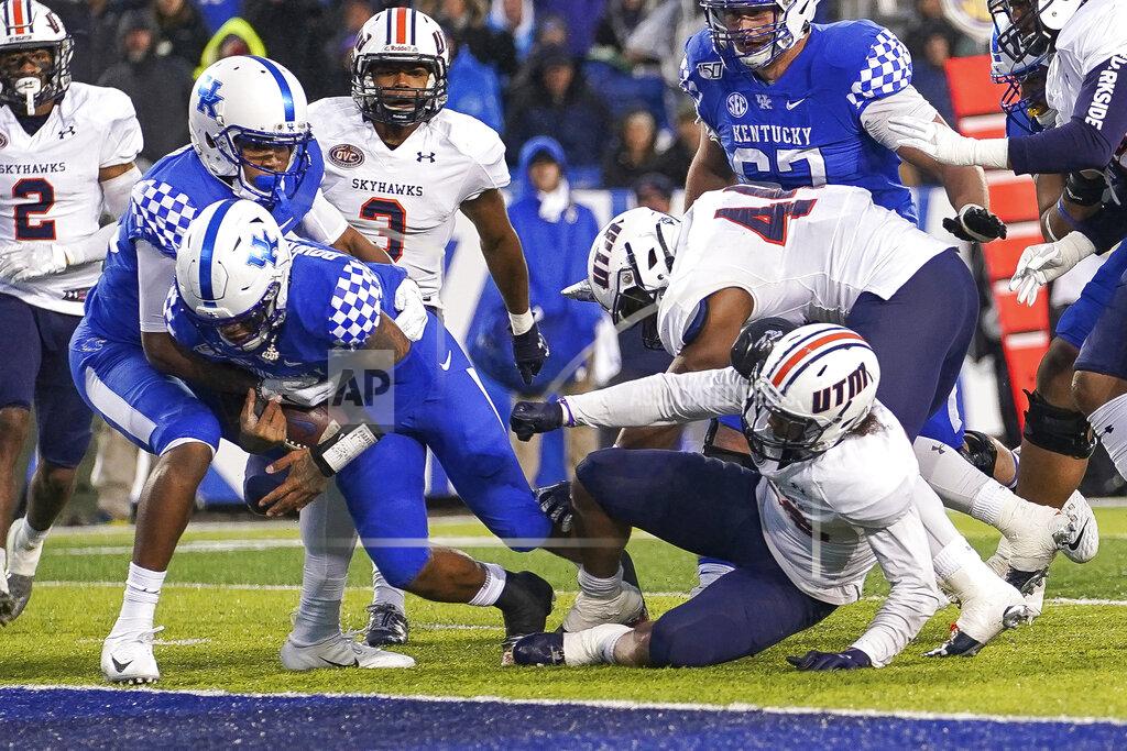 Bryan Woolston Kentucky quarterback Lynn Bowden Jr. (1) dives into the end zone for a touchdown during the first half of an NCAA college football game against UT Martin, Saturday, Nov. 23, 2019, in Lexington, Ky. (AP Photo/Bryan Woolston)
