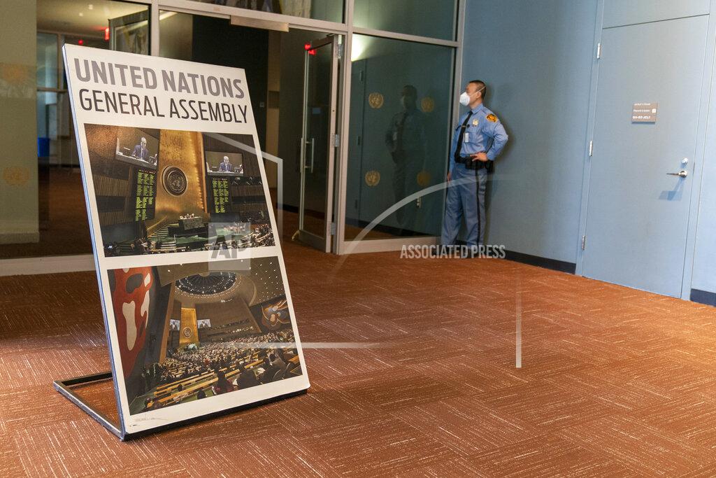 Mary Altaffer A security guard stands at the entrance to the General Assembly booths used by translators and photographers during the 75th session of the United Nations General Assembly, Tuesday, Sept. 22, 2020, at U.N. headquarters. This year's annual gathering of world leaders at U.N. headquarters will be almost entirely "virtual." Leaders have been asked to pre-record their speeches, which will be shown in the General Assembly chamber, where each of the 193 U.N. member nations are allowed to have one diplomat present. (AP Photo/Mary Altaffer)