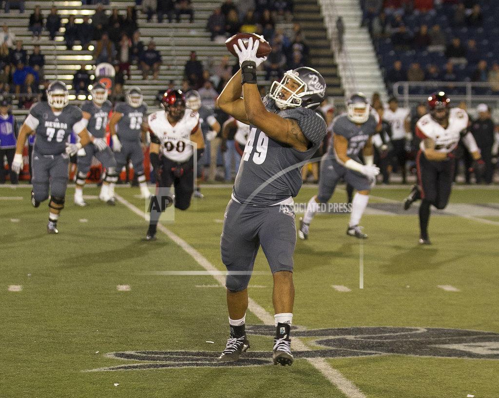 Tom R. Smedes Nevada's Trae Carter-Wells (49) makes the catch against San Diego State in the second half of an NCAA college football game in Reno, Nev., Saturday, Oct. 27, 2018. (AP Photo/Tom R. Smedes)