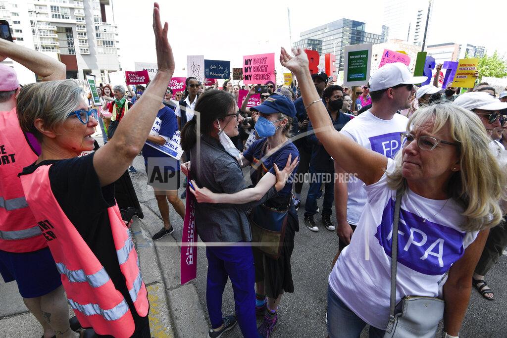 Matt Marton FILE - Staff members of the Family Planning Association clinic greet abortion rights demonstrators, May 14, 2022, in Chicago. As of June 1, minors will no longer be required to notify a parent or guardian before getting an abortion in the state, an action that abortion-rights proponents considered the last roadblock to unfettered access in Illinois. (AP Photo/Matt Marton, File)
