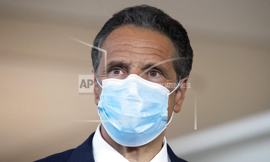 Mark Lennihan Gov. Andrew Cuomo wears a mask during a news conference at Laguardia Airport's Terminal B, Wednesday, June 10, 2020 in New York. The new terminal will open Saturday, June 13. (AP Photo/Mark Lennihan)