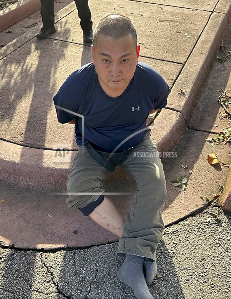 Uncredited This photo released by the U.S. Marshals Service shows Wu Chen following his arrest by the Miami Beach Police on Tuesday, Nov. 22, 2022, in South Florida. Police said Wu is a suspect in the weekend killings of four people at a marijuana farm in Oklahoma. (U.S. Marshals Service via AP)