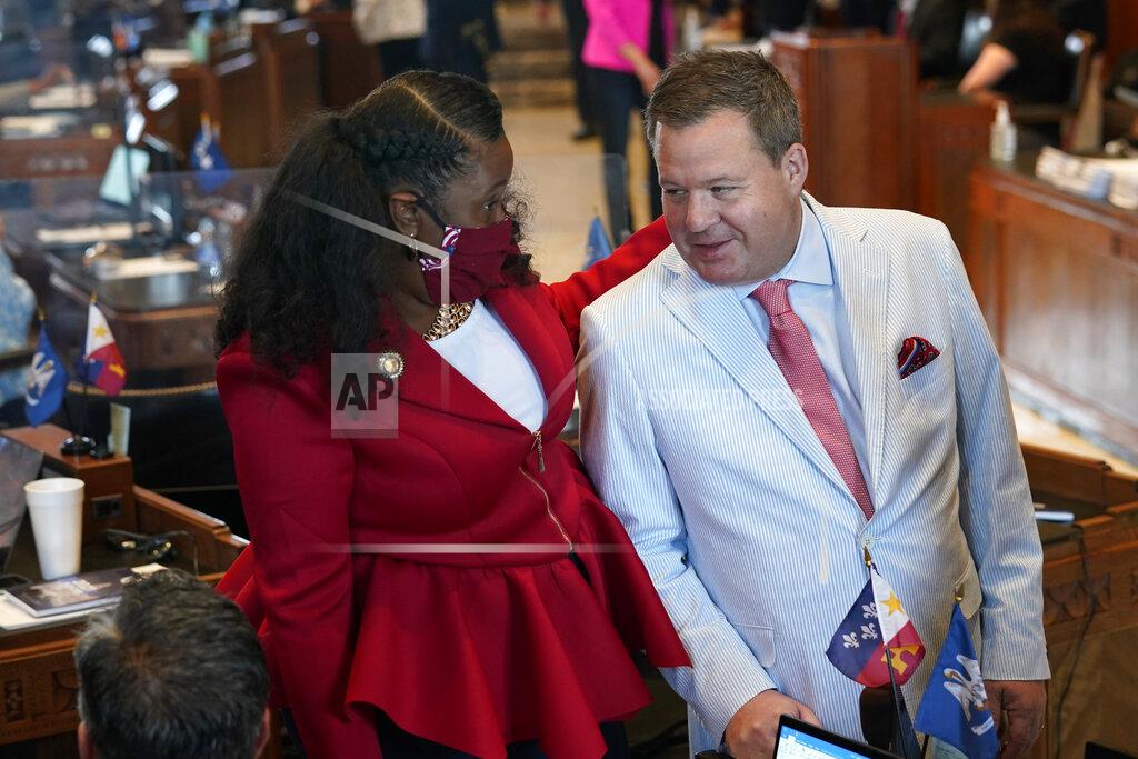 Gerald Herbert Sen. Katrina Jackson, D-Monroe, talks with Stuart Bishop, R-Lafayette, chairman of the House Ways and Means Committee, during opening day of the Louisiana legislative session in Baton Rouge, La., Monday, April 12, 2021. (AP Photo/Gerald Herbert)