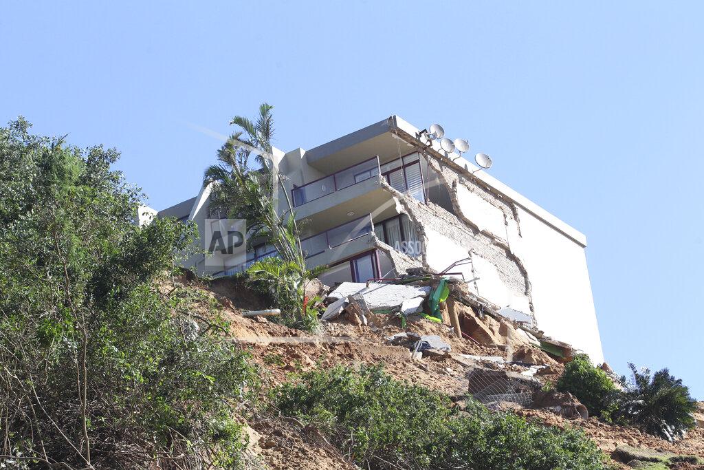 Uncredited A damaged apartment building stands on a precipice near Durban, South Africa, Monday, May 23, 2022. More than 300 people have been evacuated from their homes as a result of renewed heavy rains, flooding and mudslides in South Africa's KwaZulu-Natal province, weeks after severe flooding killed more than 400 people and displaced more than 40,000 others. (AP Photo)
