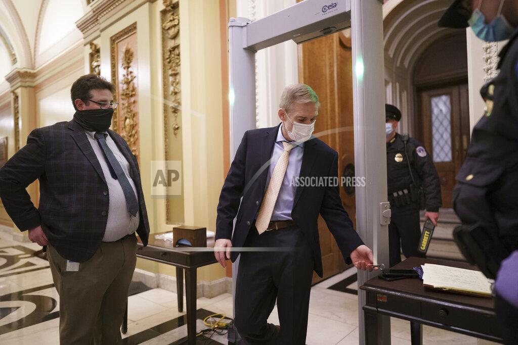 J. Scott Applewhite Rep. Jim Jordan, R-Ohio, an ally of President Donald Trump, passes through a metal detector as he enters the House chamber, new security measures put into place after a mob loyal to Trump stormed the Capitol, in Washington, Tuesday, Jan. 12, 2021. Democrats are set to pass a resolution calling on Vice President Mike Pence to invoke constitutional authority under the 25th Amendment to oust Trump. (AP Photo/J. Scott Applewhite)