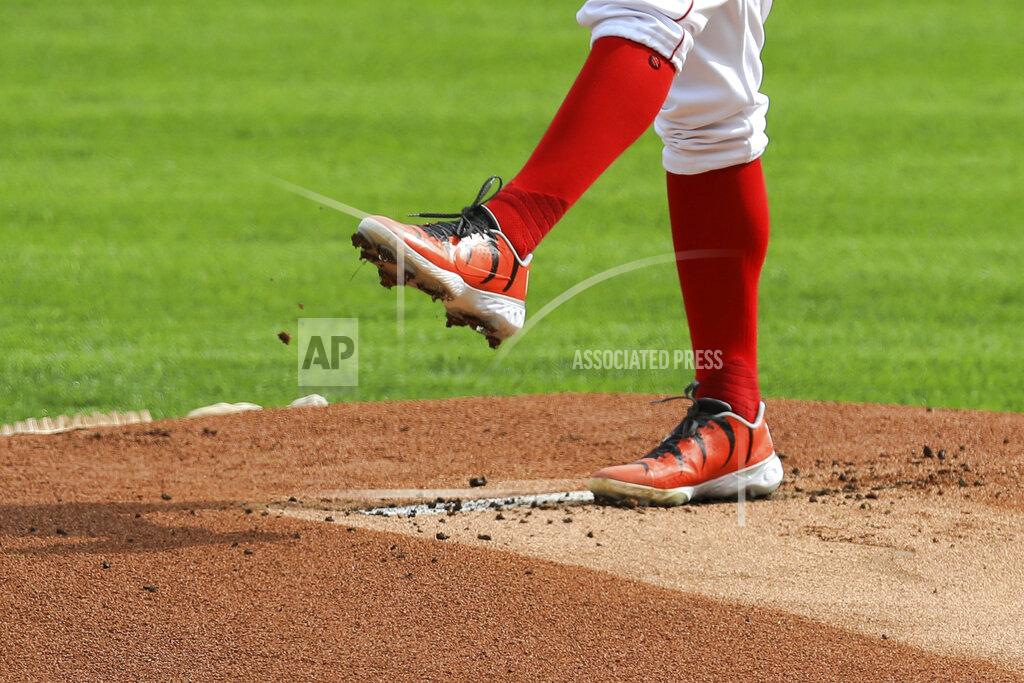 Aaron Doster Cincinnati Reds' Trevor Bauer wears custom cleats in support of the Cincinnati Bengals as he throws in the first inning during a baseball game against the Pittsburgh Pirates in Cincinnati, Monday, Sept. 14, 2020. (AP Photo/Aaron Doster)