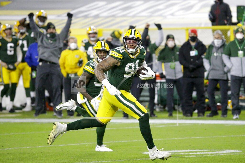 Mike Roemer Green Bay Packers' Preston Smith runs for a touchdown on a fumble recovery during the first half of an NFL football game against the Chicago Bears Sunday, Nov. 29, 2020, in Green Bay, Wis. (AP Photo/Mike Roemer)