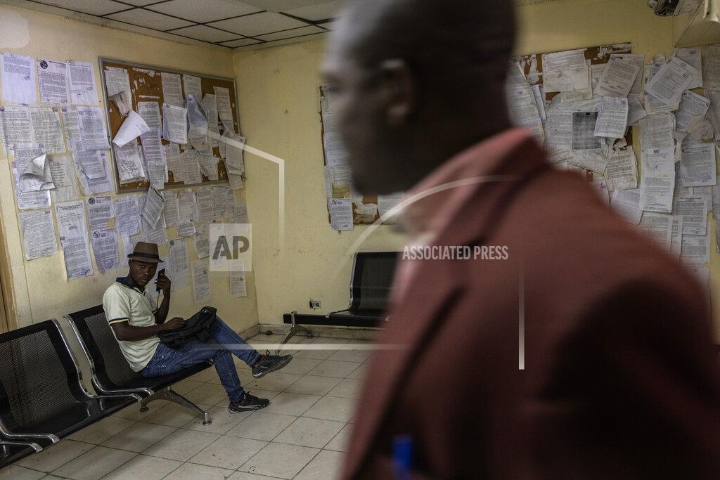 Rodrigo Abd An employee sits inside the Justice of Palace, in Port-au-Prince, Haiti, Thursday, Sept. 16, 2021. Even before the assassination of President Jovenel Moise in July, the government was weak -- the Palace of Justice inactive, congress disbanded by Moise and the legislative building pocked by bullets. (AP Photo/Rodrigo Abd)
