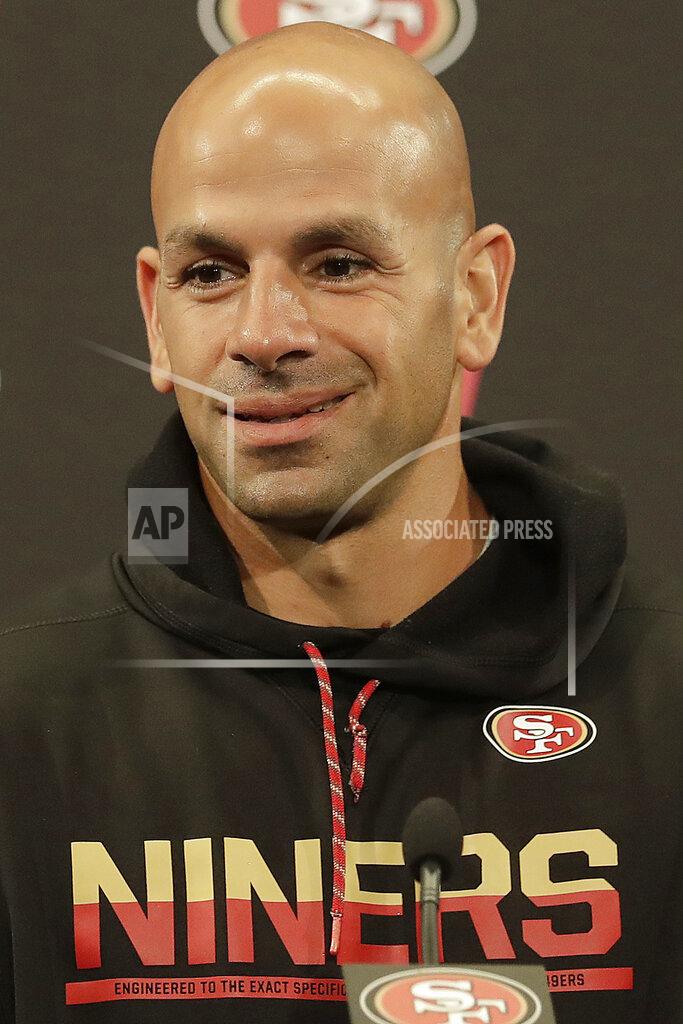 Jeff Chiu FILE - In this May 30, 2018, file photo, San Francisco 49ers defensive coordinator Robert Saleh speaks to reporters after a practice at the team's NFL football training facility, in Santa Clara, Calif. Green Bay Packers coach Matt Lafleur considers Saleh one of his best friends. When Green Bay coach Matt LaFleur started preparing to face San Francisco's stellar defense, he sent out a text message trying to get some inside information. (AP Photo/Jeff Chiu, File)
