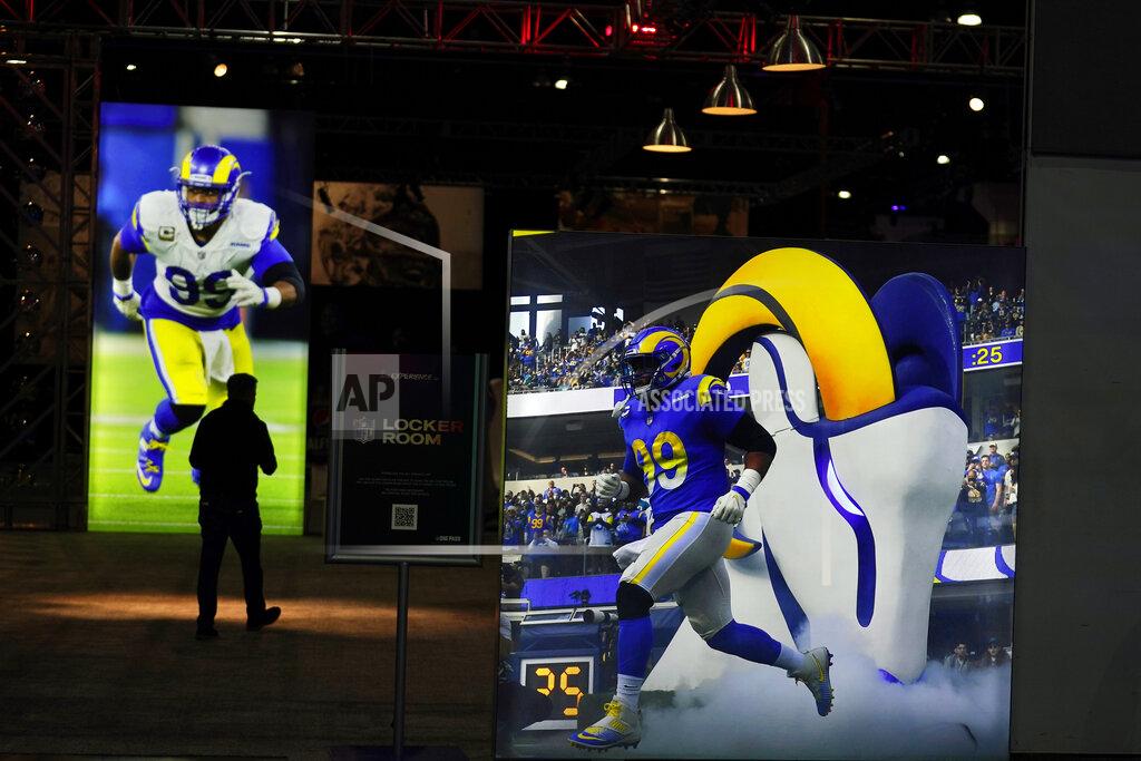 Marcio Jose Sanchez Images of Los Angeles Rams defensive end Aaron Donald are displayed inside the NFL Experience, an interactive fan show, Friday, Feb. 4, 2022, at the Los Angeles Convention Center in Los Angeles. The Rams are scheduled to play the Cincinnati Bengals in the Super Bowl NFL football game Feb. 13 in Inglewood, Calif. (AP Photo/Marcio Jose Sanchez)