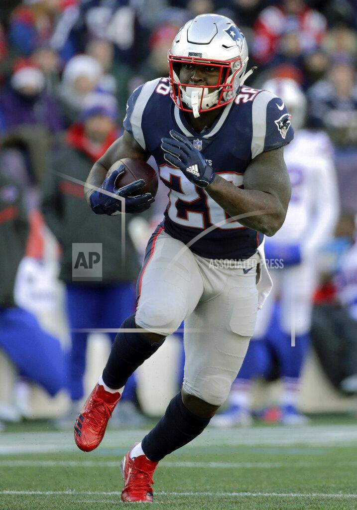 FILE- In this Dec. 23, 2018, file photo, New England Patriots running back Sony Michel carries the ball against the Buffalo Bills during the first half of an NFL football game in Foxborough, Mass. Sony Michel was a freshman and Todd Gurley a junior when the pair shared the backfield together at the University of Georgia. Now the former Bulldogs teammates will be on opposite sides when they meet in the Super Bowl. (AP Photo/Elise Amendola, File)