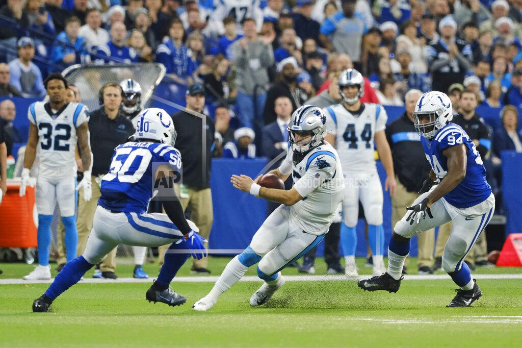 Aj Mast Carolina Panthers quarterback Will Grier (3) is tackled by Indianapolis Colts' Anthony Walker (50) and Tyquan Lewis (94) during the first half of an NFL football game, Sunday, Dec. 22, 2019, in Indianapolis. (AP Photo/AJ Mast)
