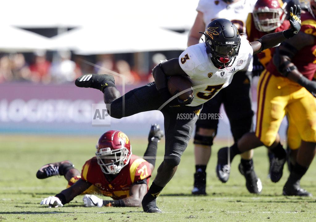 Marcio Jose Sanchez Arizona State running back Eno Benjamin (3) runs for a touchdown past Southern California cornerback Ajene Harris, bottom left, during the first half of an NCAA college football game Saturday, Oct. 27, 2018, in Los Angeles. (AP Photo/Marcio Jose Sanchez)