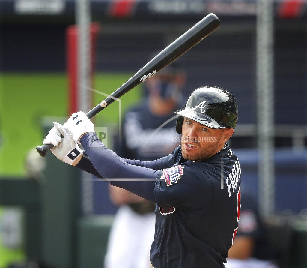 Curtis Compton Atlanta Braves first baseman Freddie Freeman watches his hit during live batting practice before playing the Baltimore Orioles in a spring baseball game at CoolToday Park in North Port, Fla., Wednesday, March 3, 2021. (Curtis Compton/Atlanta Journal-Constitution via AP)