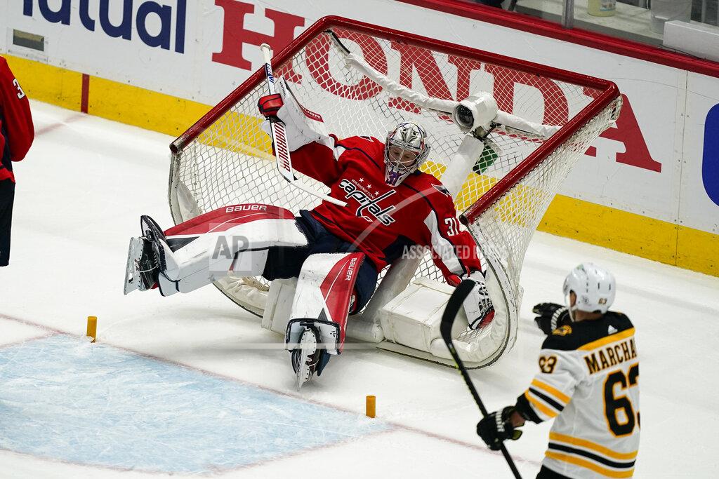 Alex Brandon Washington Capitals goaltender Craig Anderson (31) falls into the net during the first period of Game 1 of the team's NHL hockey Stanley Cup first-round playoff series against the Boston Bruins, Saturday, May 15, 2021, in Washington. (AP Photo/Alex Brandon)