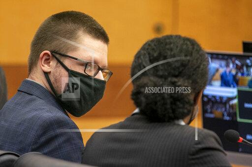 Robert Aaron Long appears in front of Fulton County Superior Court Judge Ural Glanville at the Fulton County Courthouse in downtown Atlanta, Monday, Aug. 30, 2021. The man accused of killing eight people at Atlanta area massage businesses who has already pleaded guilty in four of the killings appeared briefly in court but his arraignment in the other four slayings was rescheduled. (Alyssa Pointer/Atlanta Journal Constitution via AP)