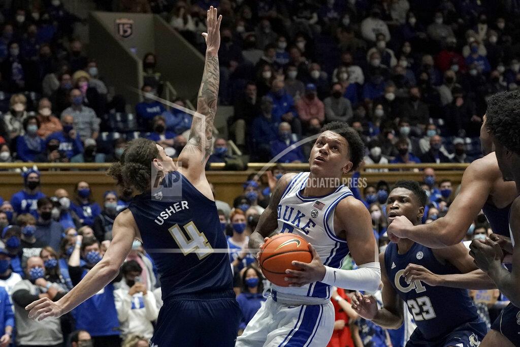 Gerry Broome Georgia Tech guard Jordan Usher (4) defends against Duke forward Paolo Banchero during the second half of an NCAA college basketball game in Durham, N.C., Tuesday, Jan. 4, 2022. (AP Photo/Gerry Broome)