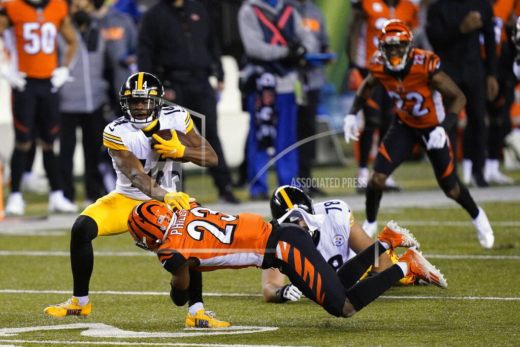 Bryan Woolston Pittsburgh Steelers' Ray-Ray McCloud (14) is tackled by Cincinnati Bengals' Darius Phillips (23) during the first half of an NFL football game, Monday, Dec. 21, 2020, in Cincinnati. (AP Photo/Bryan Woolston)