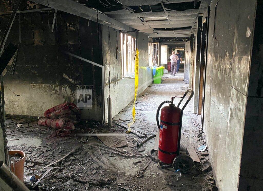Khalid Mohammed The intensive care unit of the Ibn al-Khatib hospital is damaged following a fire that broke out of last Saturday evening killing over 80 people and injuring over 100, in Baghdad, Iraq, Tuesday, April 27, 2021. Medical staff who witnessed the first moments of a Baghdad hospital fire described horrific scenes: deafening screams, a patient who jumped to his death to escape the inferno and relatives who died because they refused to abandon coronavirus patients tethered to ventilators. (AP Photo/Khalid Mohammed)