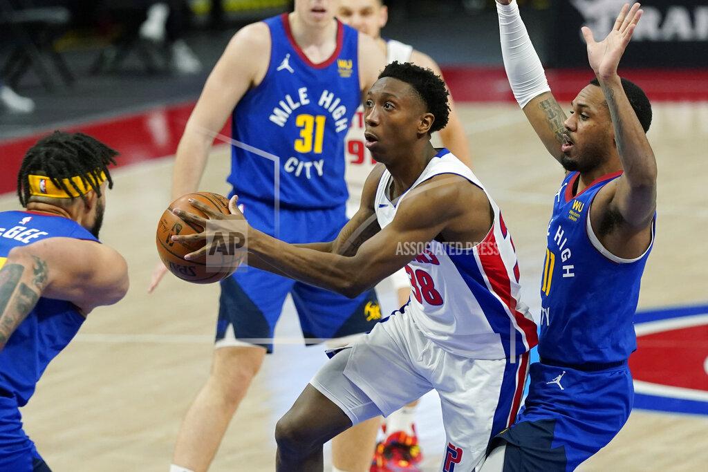 Carlos Osorio Detroit Pistons guard Saben Lee (38) passes as Denver Nuggets center JaVale McGee, left, defends during the second half of an NBA basketball game, Friday, May 14, 2021, in Detroit. (AP Photo/Carlos Osorio)