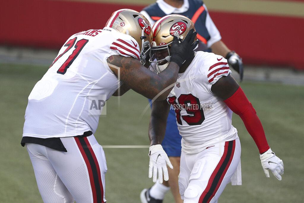 Jed Jacobsohn San Francisco 49ers wide receiver Deebo Samuel, right, is congratulated by Trent Williams after scoring a touchdown against the Los Angeles Rams during the first half of an NFL football game in Santa Clara, Calif., Sunday, Oct. 18, 2020. (AP Photo/Jed Jacobsohn)